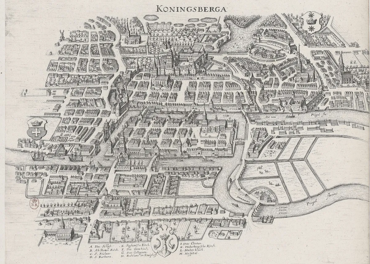 An engraved bird's-eye view of a walled river city, hundreds of gabled houses drawn individually, a river forking around a central island, and a lettered key along the bottom edge.