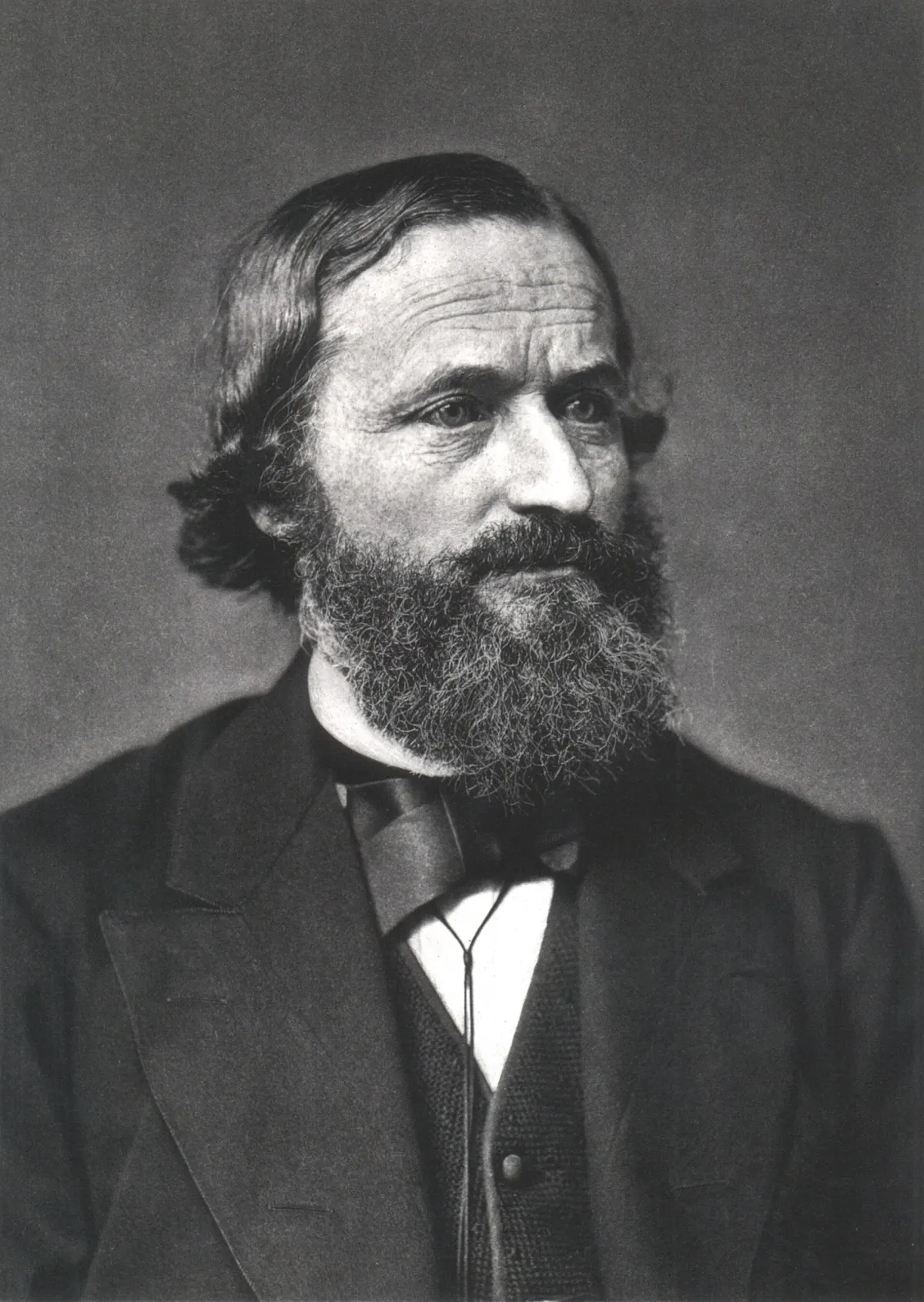 A nineteenth-century black and white photographic portrait of a man in formal dress, shown from the chest up.